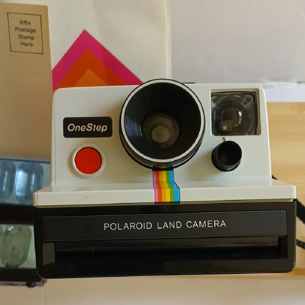 Vintage Polaroid Land One Step Instant Film Camera with Iconic Rainbow Design